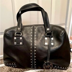 Authentic Michael Kors black leather silver studded handbag.